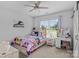 Stylish bedroom featuring personalized decor, a ceiling fan, and natural light at 615 N Oak Dr, Huntersville, NC 28078