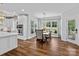 Open concept kitchen with dining area, stainless steel appliances, and lots of natural light at 615 N Oak Dr, Huntersville, NC 28078