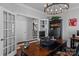 Stylish home office with a view into the house, a large desk, and custom shelving for storage at 615 N Oak Dr, Huntersville, NC 28078