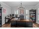 Spacious home office with a large desk, multiple computer setups, and ample storage options at 615 N Oak Dr, Huntersville, NC 28078