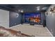 Private home theater with a large screen, surround sound speakers, and plush leather seating at 615 N Oak Dr, Huntersville, NC 28078