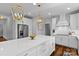 Modern kitchen featuring stainless steel appliances, a large island, white cabinets, and plenty of counter space at 615 N Oak Dr, Huntersville, NC 28078