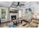 Cozy living room with a fireplace, stylish decor, and a comfortable seating area at 615 N Oak Dr, Huntersville, NC 28078