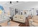 Open-concept living room showcasing a seamless flow to the kitchen and staircase at 615 N Oak Dr, Huntersville, NC 28078