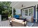 Covered patio featuring comfortable seating and a cozy fire pit for outdoor gatherings at 615 N Oak Dr, Huntersville, NC 28078