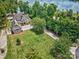 Aerial view showcasing a beautifully landscaped yard, complemented by a well-maintained home and a charming driveway at 6216 North Rd, York, SC 29745