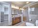 Luxurious bathroom features a vanity with granite countertop, a glass-enclosed shower, and a walk-in closet at 6216 North Rd, York, SC 29745