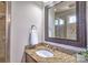 Bathroom showcasing granite countertop, framed mirror, and a glass-enclosed shower/tub at 6216 North Rd, York, SC 29745