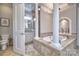 Spa-like bathroom with soaking tub, elegant columns, and stylish fixtures for relaxation and comfort at 6216 North Rd, York, SC 29745
