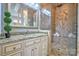 This primary bath boasts granite countertops, an elegant tile shower, and natural light at 6216 North Rd, York, SC 29745