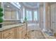 This bathroom features granite countertops, tile floors, a window view and elegant cabinetry at 6216 North Rd, York, SC 29745