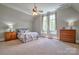 Bright bedroom features neutral colors, a ceiling fan, and abundant natural light at 6216 North Rd, York, SC 29745