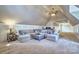 Spacious bonus room with neutral carpet, a large sectional couch, and ample natural light at 6216 North Rd, York, SC 29745