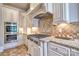 Gourmet kitchen featuring granite countertops, custom cabinets, and a stainless steel oven and cooktop at 6216 North Rd, York, SC 29745