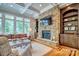 Cozy living room with a stone fireplace, built-in shelving, and large windows at 6216 North Rd, York, SC 29745