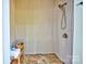 This unique shower area features light beige corrugated walls and a stone floor, creating a modern, yet rustic aesthetic at 6216 North Rd, York, SC 29745