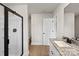 Well-lit bathroom featuring a shower, vanity, and granite countertops at 7008 Jerimoth Dr, Charlotte, NC 28215