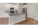 Beautiful kitchen with granite countertops, stainless steel appliances and a large kitchen island at 7008 Jerimoth Dr, Charlotte, NC 28215