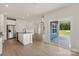 Spacious, open-concept design seamlessly connects the kitchen, dining, and living areas with ample natural light at 7008 Jerimoth Dr, Charlotte, NC 28215