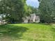 Charming home featuring a well-manicured lawn and mature trees, offering a serene and inviting curb appeal at 7137 Sythe Ct, Charlotte, NC 28226
