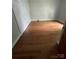 Bedroom featuring vinyl floors and two doors at 716 N Fulton St, Salisbury, NC 28144