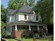 Charming two-story home with a welcoming front porch and a well-maintained lawn, perfect for relaxed outdoor living at 716 N Fulton St, Salisbury, NC 28144