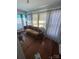 Living room featuring hardwood floors and large windows creating a bright and airy space at 716 N Fulton St, Salisbury, NC 28144