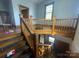 Staircase with beautiful wood railing, leading to the upper level of the home at 716 N Fulton St, Salisbury, NC 28144