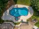 Aerial view of the property showcasing a large swimming pool, spa, and well-manicured landscaping at 7912 Baltusrol Ln, Charlotte, NC 28210