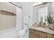 Neutral bathroom features a tub with shower, single vanity, and granite counters at 7912 Baltusrol Ln, Charlotte, NC 28210