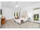 Spacious bedroom with neutral walls, carpet, bay window, and a glass door at 7912 Baltusrol Ln, Charlotte, NC 28210