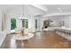 Inviting dining area with outdoor access and views, open to the living room at 7912 Baltusrol Ln, Charlotte, NC 28210
