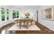 Elegant dining room featuring a chandelier, large windows, and stylish decor at 7912 Baltusrol Ln, Charlotte, NC 28210