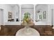 Inviting foyer with hardwood floors and a grand window, flooded with natural light at 7912 Baltusrol Ln, Charlotte, NC 28210