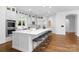 Expansive kitchen with island seating, stainless steel appliances, and bright natural light at 7912 Baltusrol Ln, Charlotte, NC 28210