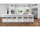 Spacious kitchen featuring a large island with seating, modern appliances, and white cabinetry at 7912 Baltusrol Ln, Charlotte, NC 28210