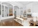 Elegant living room featuring a fireplace, wood floors, and coffered ceilings at 7912 Baltusrol Ln, Charlotte, NC 28210