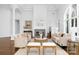 Cozy living room with a fireplace, plush seating, and stylish decor at 7912 Baltusrol Ln, Charlotte, NC 28210