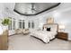 Serene main bedroom featuring large windows, soft lighting, and elegant furnishings at 7912 Baltusrol Ln, Charlotte, NC 28210