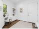 Office with a built-in desk, shelves, neutral-toned decor and a large window at 7912 Baltusrol Ln, Charlotte, NC 28210