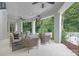 Relaxing outdoor patio with comfortable seating and lush greenery, ideal for entertaining guests at 7912 Baltusrol Ln, Charlotte, NC 28210
