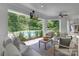 Inviting covered patio with comfortable seating and a view of the sparkling swimming pool at 7912 Baltusrol Ln, Charlotte, NC 28210