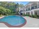 Beautiful backyard with a large swimming pool and spa, perfect for summer relaxation at 7912 Baltusrol Ln, Charlotte, NC 28210