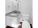 Clean, well-lit bathroom with white cabinets, granite countertop, modern fixtures, and neutral tones at 8219 Pozzi Rd, Charlotte, NC 28216