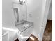 Stylish bathroom with granite countertop and wood-look flooring at 8219 Pozzi Rd, Charlotte, NC 28216