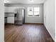 Bright kitchen featuring stainless steel appliances, granite countertops, and wood-look flooring at 8219 Pozzi Rd, Charlotte, NC 28216