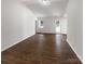 Spacious living area with hardwood floors, a back door, and bright natural light at 8219 Pozzi Rd, Charlotte, NC 28216