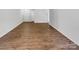 Spacious living room featuring wood-look flooring and bright natural light at 8219 Pozzi Rd, Charlotte, NC 28216