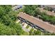 An aerial view of townhomes surrounded by lush trees and parking areas at 8310 Brickle Ln, Huntersville, NC 28078