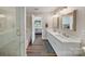 Bright bathroom features double vanity, glass shower, and soaking tub at 8310 Brickle Ln, Huntersville, NC 28078